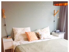 Ruimtelijk en stijlvol wonen in een klein huis slaapkamer opgemaakt bed