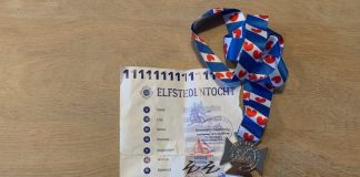 Mijn ervaring met de Elfstedentocht fietsen medaille en stempels