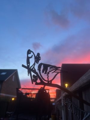 metal bird sunset